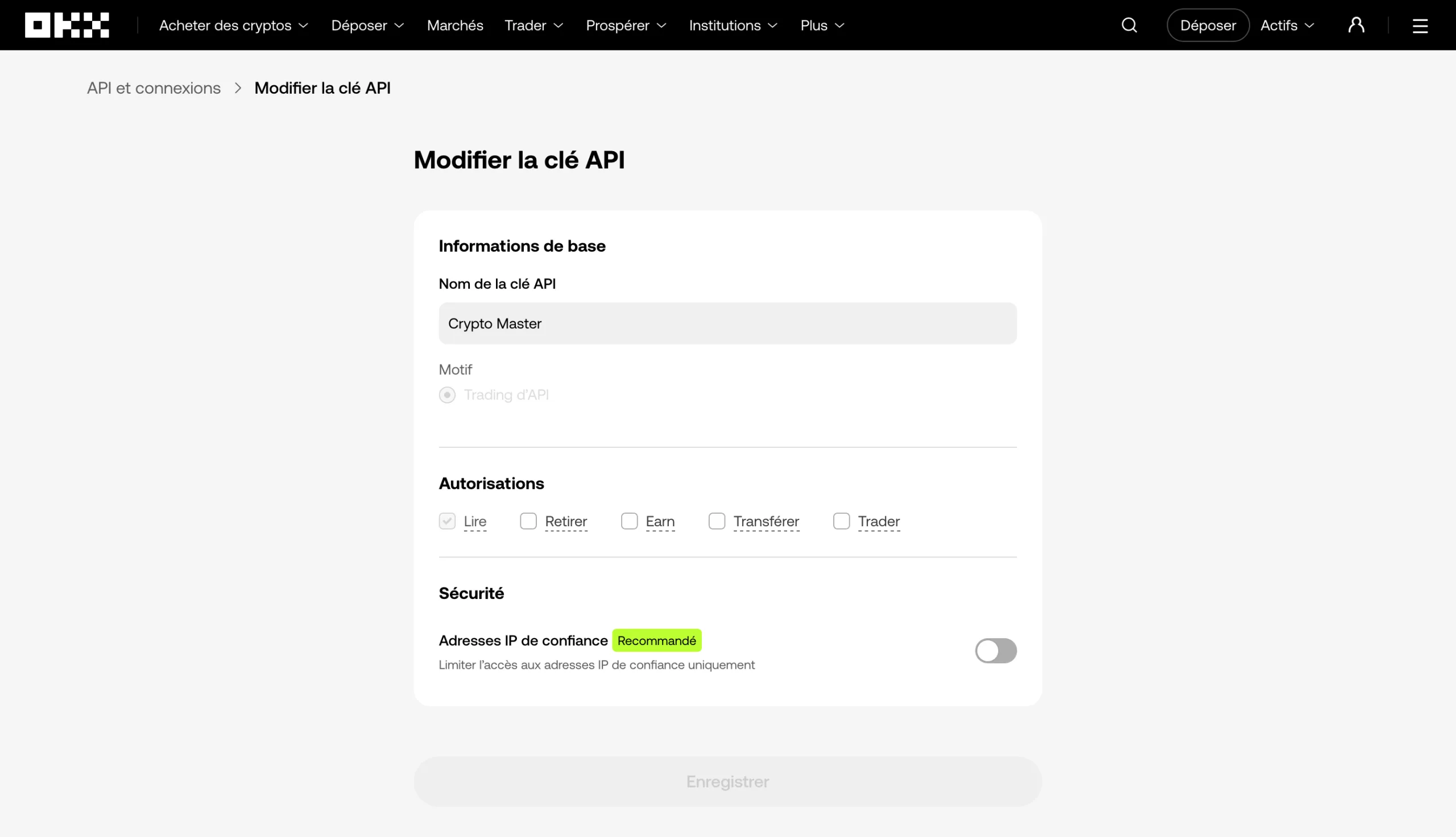 Écran de modification d’une clé API d’OKX : l’autorisation « Lire » cochée, « Retirer », « Earn », « Transférer » et « Trader » décochées, adresses IP de confiance désactivées